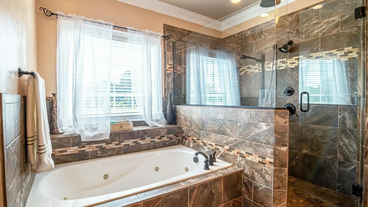 bathroom mold removal — neglected bathroom with stained grout joints and dirty tile caulk lines showing mold-prone conditions