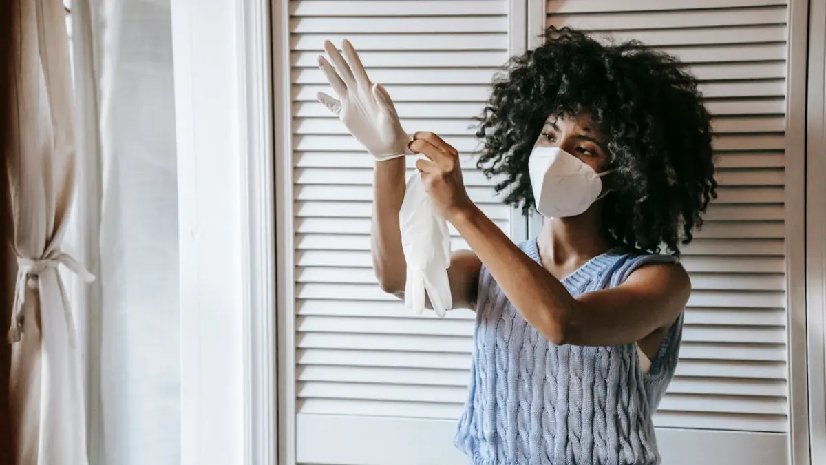 Crawl Space Mold Removal safety preparation with gloves and protective mask