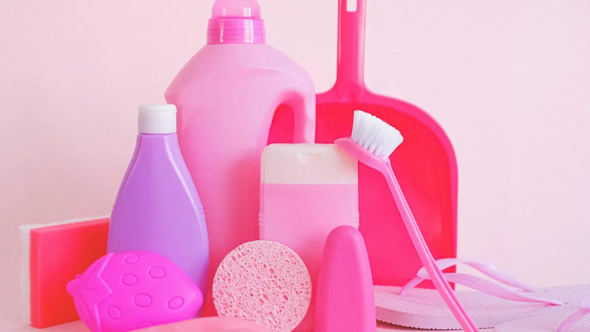 Colorful collection of household cleaning spray bottles and product containers — choosing the right solution is the most misunderstood step in DIY mold removal
