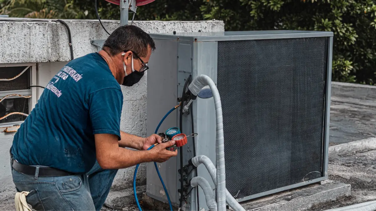 HVAC technician servicing cooling equipment to prevent mold in air ducts and moisture buildup